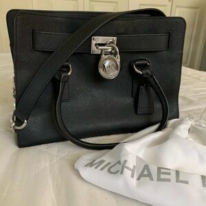 Satchel with Structured Design and Silver Hardware. Lost dustbag